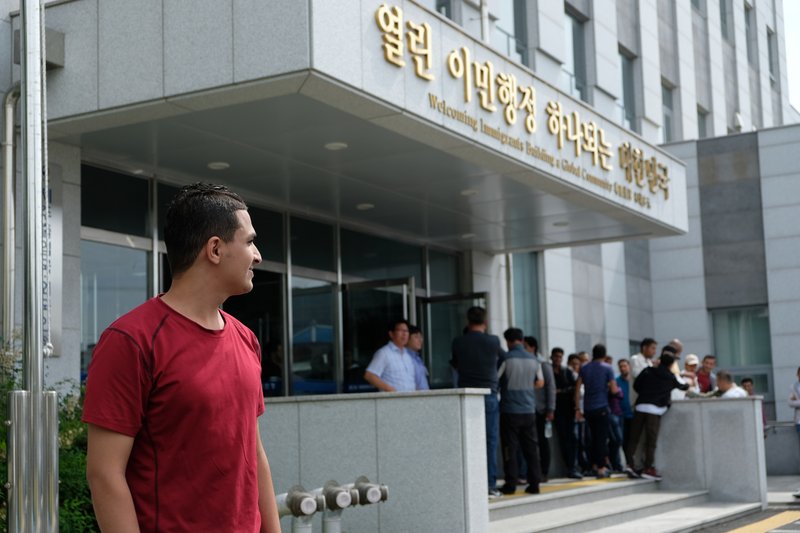 Yemeni asylum seeker Ahmed Abdu, 21, stands in front of the Jeju Immigration Office on June 19, 2018. 