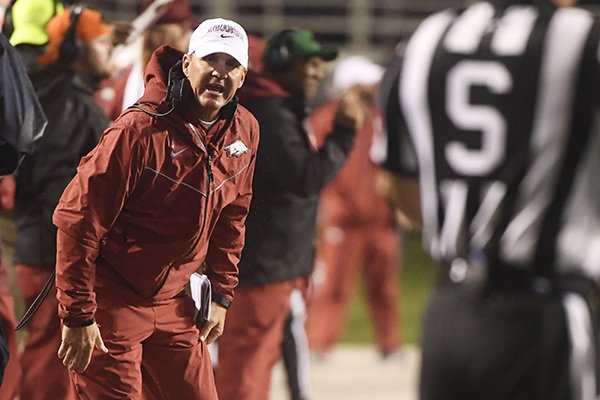 Arkansas coach Chad Morris talks with the officials after a penalty in the first half of an NCAA college football game Saturday, Oct. 13, 2018, in Little Rock, Ark. (AP Photo/Michael Woods)

