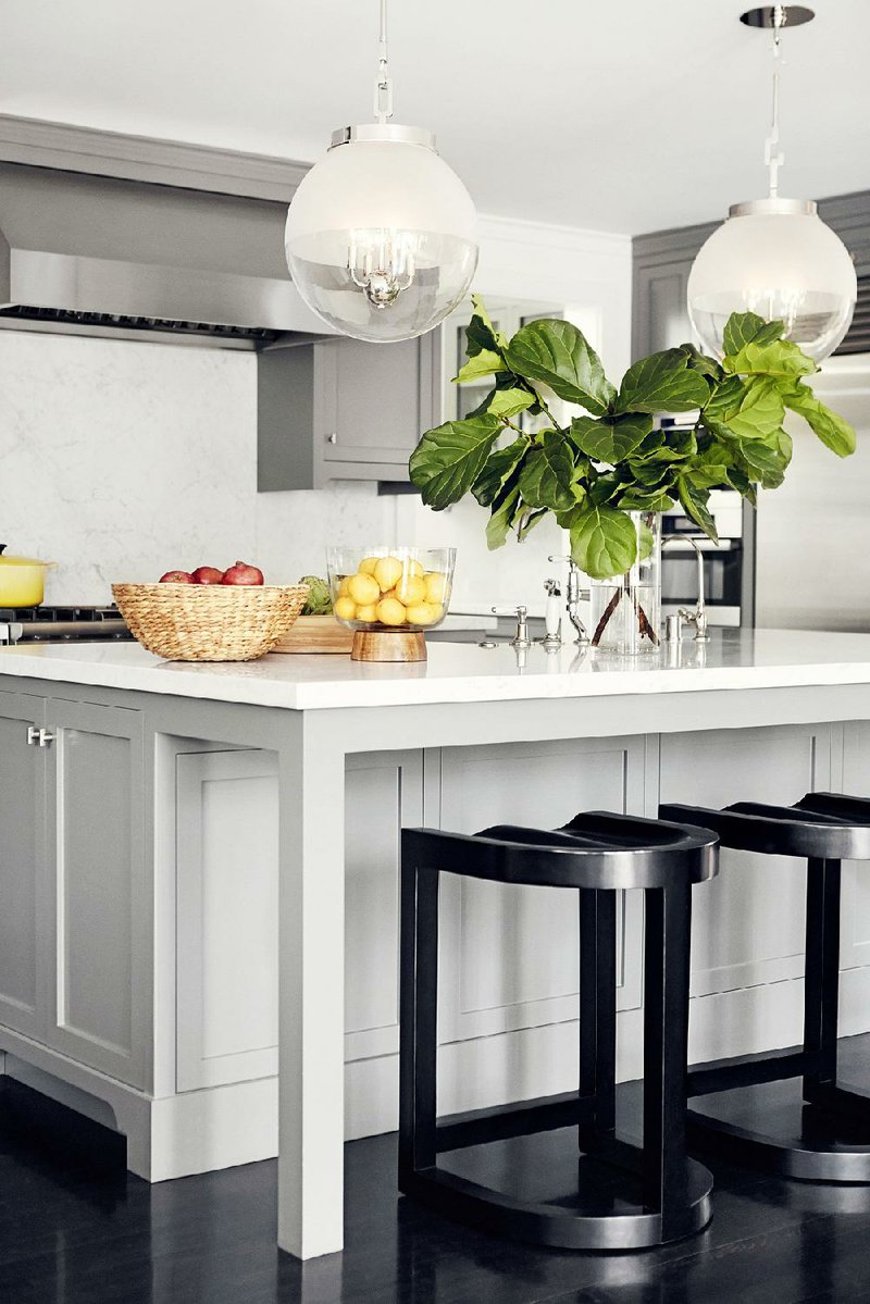 One key to planning a great kitchen island, Designer Betsy Burnham says, is leaving plenty of legroom for barstool seating along one side.