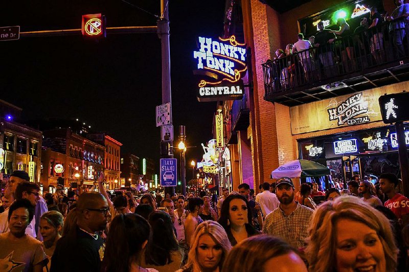 Saturday night crowds fill the streets of Nashville’s rowdy LoBro district, along Lower Broadway. Also known as the Honky Tonk Highway, the district is a blur of clubs and parties. 