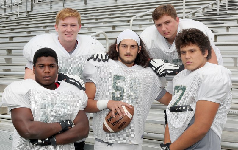 NWA Democrat-Gazette/DAVID GOTTSCHALK Alma High School football offensive line Darion Crawford (from left), Levi Prestidge, Nick Archer, Zac Henson and Eli Aleck Tuesday, October 16, 2018, at Airedale Stadium on the campus in Alma.