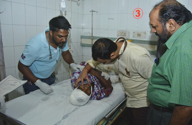 A man who got injured in a train accident receives treatment at a hospital in Amritsar, India, Friday, Oct. 19, 2018. A speeding train ran over a crowd watching fireworks during a religious festival in northern India on Friday, killing at least 50 people, a Congress party leader said. (AP Photo/Prabhjot Gill)