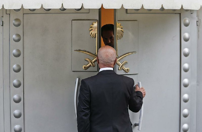 A man prepares to enter the Saudi Arabia Consulate in Istanbul on Friday. The Saudis’ claim that journalist Jamal Khashoggi was killed in a fistfight in the consulate was met with skepticism by American lawmakers. 