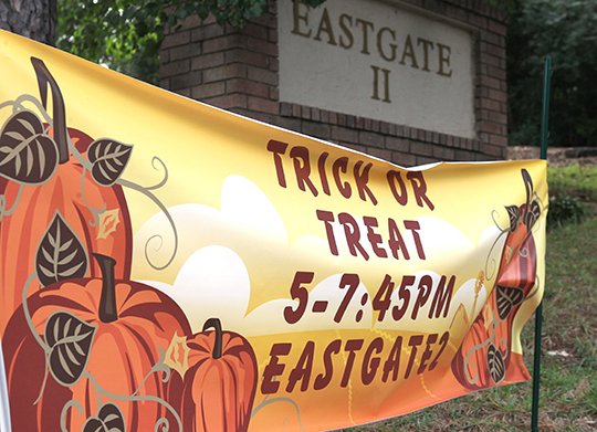 The Sentinel-Record/Richard Rasmussen SET TIME: A sign at the entrance of Eastgate II subdivision displays this year's trick-or-treat time of 5-7:45 p.m. Oct. 31. After two emergencies in 2017, residents of the neighborhood devised a plan including a designated time and specific areas for parking in order to keep residents and those visiting the neighborhood safe on the holiday.