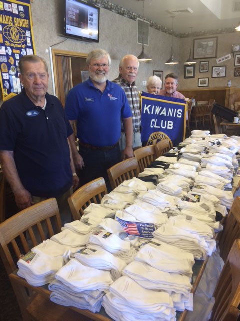 Courtesy photo The Springdale Kiwanis Club recently presented 600 pairs of socks to the Springdale Post of the American Legion. These socks will be given to the men and women veterans at the Northwest Arkansas Veterans Home in Fayetteville. Pictured are Kiwanian Don Williams, American Legion Post Commander Albert Wille, John Thompson, Joanna Williams and Kiwanis President Michael Weir.