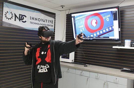 NPC student William Orman experiences a virtual reality oculus set-up at the NPC Innovative Technologies Center Makerspace grand opening event Friday, October 19, 2018. (The Sentinel-Record/Richard Rasmussen)