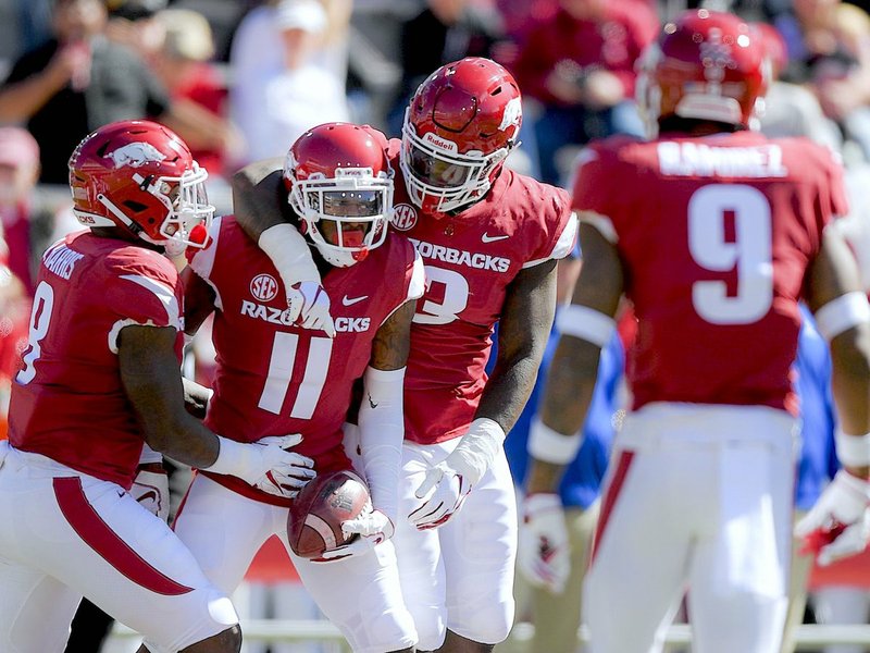 NWA Democrat-Gazette/CHARLIE KAIJO Arkansas Razorbacks defensive back Ryan Pulley (11) reacts after intercepting a pass intended for Tulsa Golden Hurricane wide receiver Keylon Stokes (2) during the second quarter of a football game, Saturday, October 20, 2018 at Donald W. Reynolds Razorback Stadium in Fayetteville.

