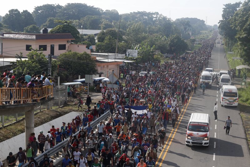 Central American migrants walking to the U.S. start their day Sunday departing Ciudad Hidalgo, Mexico. Despite Mexican efforts to stop them at the border, about 5,000 Central American migrants resumed their advance toward the U.S. border. (AP Photo/Moises Castillo)