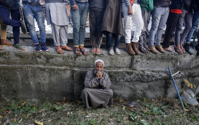 An elderly Kashmiri villager cries during the funeral of Uzair Mushtaq in Kulgam 75 Kilometers south of Srinagar, Indian controlled Kashmir, Sunday, Oct. 21, 2018. Three local rebels were killed in a gunbattle with Indian government forces in disputed Kashmir on Sunday, and six civilians were killed in an explosion at the site after the fighting was over, officials and residents said. (AP Photo/Mukhtar Khan)