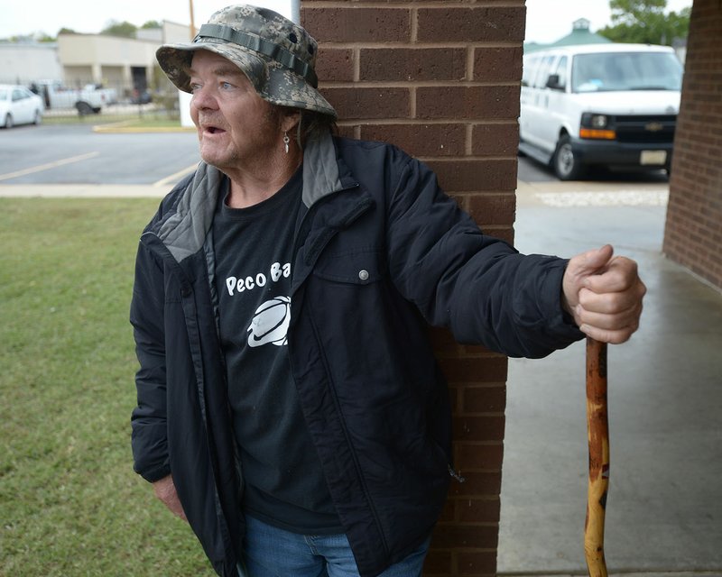 NWA Democrat-Gazette/ANDY SHUPE Kenny Stone of Fayetteville speaks Thursday outside the Salvation Army's shelter facility in south Fayetteville. The organization is busy assisting about 100 more residents after people who were living in an encampment near 19th Street, which was cleared earlier this summer.
