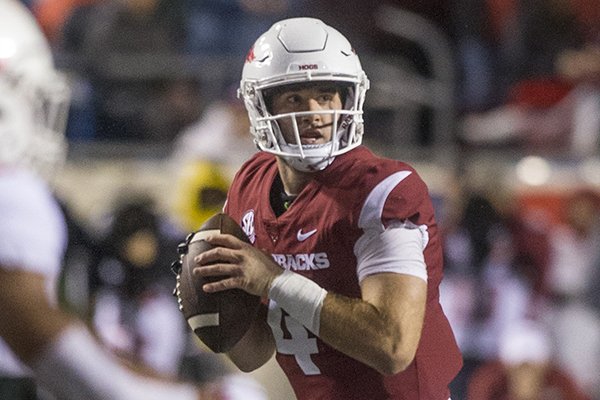Ty Storey, Arkansas quarterback, looks for a receiver in the 1st quarter vs Ole Miss Saturday, Oct. 13, 2018, at War Memorial Stadium in Little Rock.