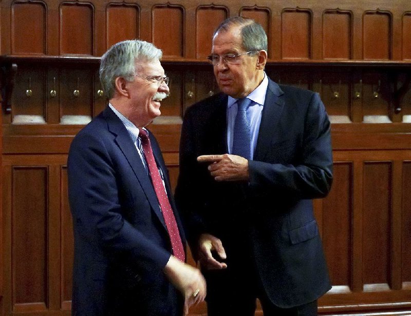 U.S. national security adviser John Bolton (left) meets with Russian Foreign Minister Sergey Lavrov on Monday in Moscow. Bolton and Russian officials discussed a variety of issues, including the U.S.’ decision to withdraw from a 1987 nuclear weapons treaty. 