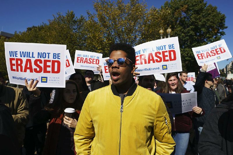 The National Center for Transgender Equality and the Human Rights Campaign gather on Pennsylvania Avenue in front of the White House in Washington on Monday for a #WontBeErased rally.