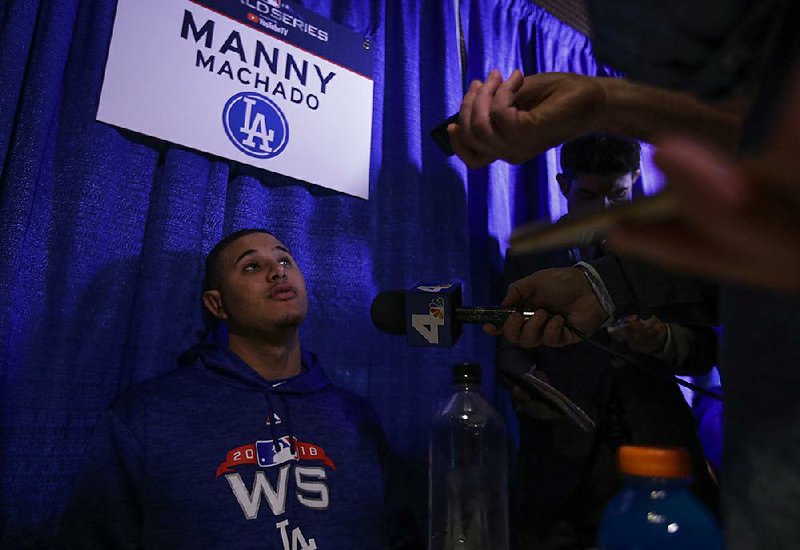 Manny Machado of the Los Angeles Dodgers answers questions Monday ahead of tonight’s Game 1 of the World Series in Boston, where Machado is especially despised for an incident involving Red Sox second baseman Dustin Pedroia in April 2017.