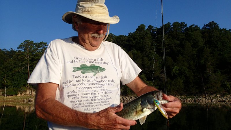NWA Democrat-Gazette/FLIP PUTTHOFF 
Dwayne Culmer's shirt shows how much gear can be accumulated when one enjoys fishing or other outdoor pursuits.