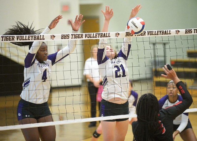 Fayetteville’s Avery Redfern (21) and Adrianna Walter reach to block a shot by Fort Smith Northside’s Nakiah Willis (right) during Tuesday’s Class 6A state tournament action in Bentonville. The defending state champions advanced to face Springdale Har-Ber at 5 p.m. today.