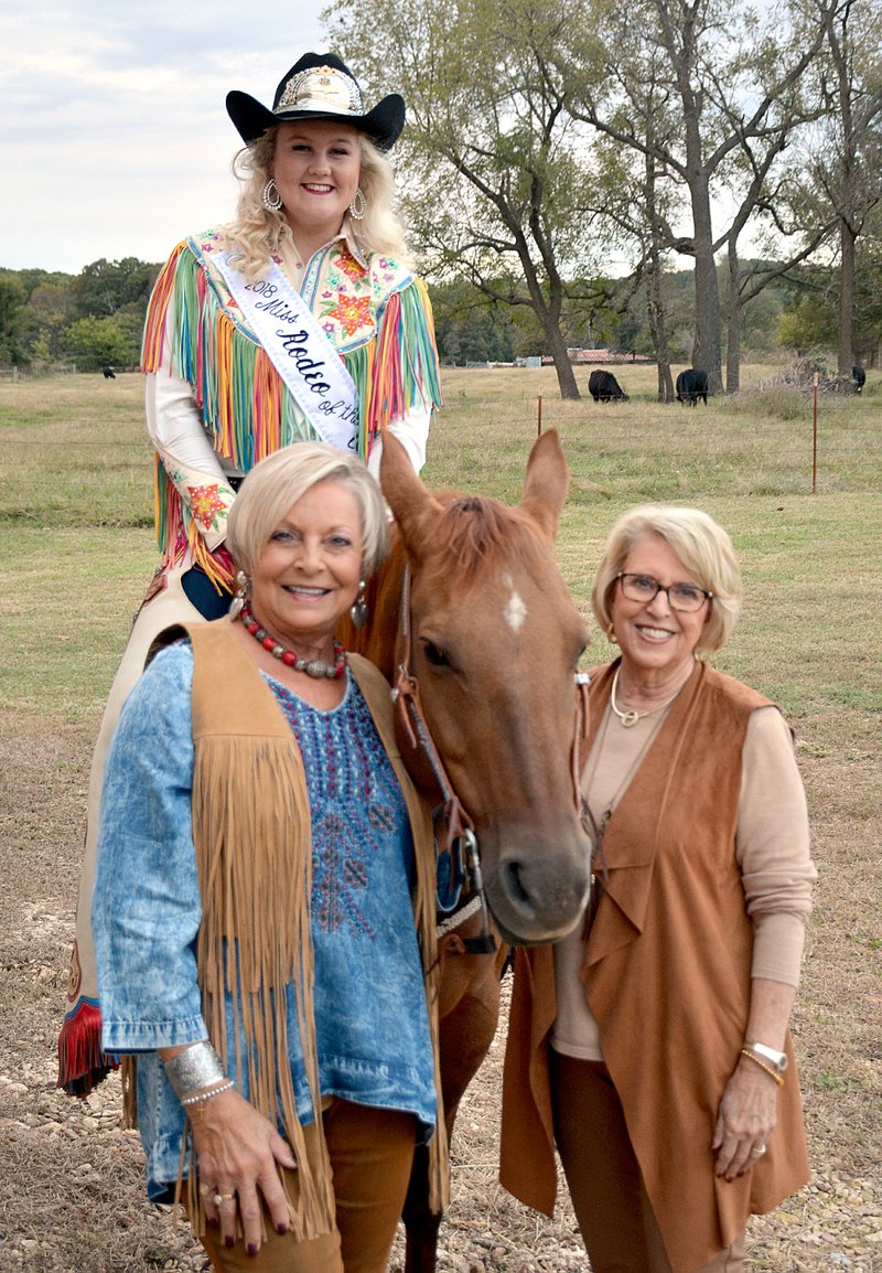 Janelle Jessen/Herald-Leader Shirley Dilbeck, left, and Suellen Coleman-Chase, right, posed for a picture with Lindsey Thompson, 2018 Rodeo of the Ozarks Queen, and her horse Pretty Girl. Thompson greeted guests and posed for pictures at the Friends of Main Street Academy fundraiser on Thursday, themed "Cowboy up for Main Street Academy.