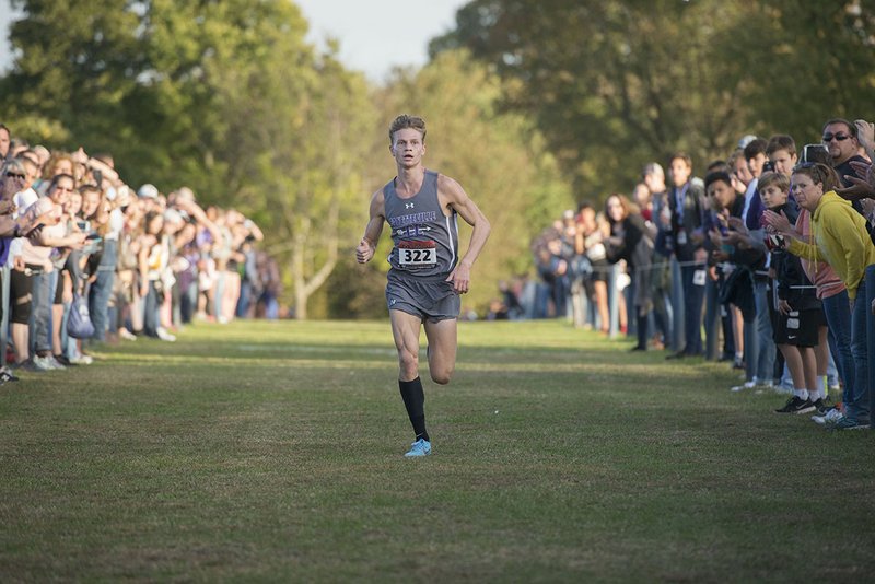 NWA Democrat-Gazette/J.T. WAMPLER Fayetteville's Camren Fischer eyes the finish line Tuesday Oct. 23, 2018 at the 6A-West Conference cross country meet at Rogers High School.