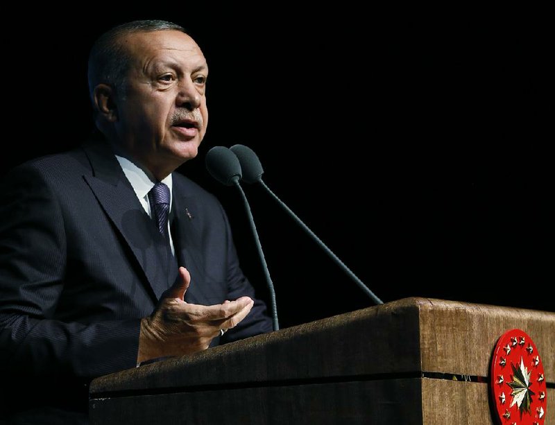 Turkish President Recep Tayyip Erdogan, shown speaking Wednesday at a symposium in Ankara, Turkey, said no one connected with the death of Saudi journalist Jamal Khashoggi will “avoid justice.”