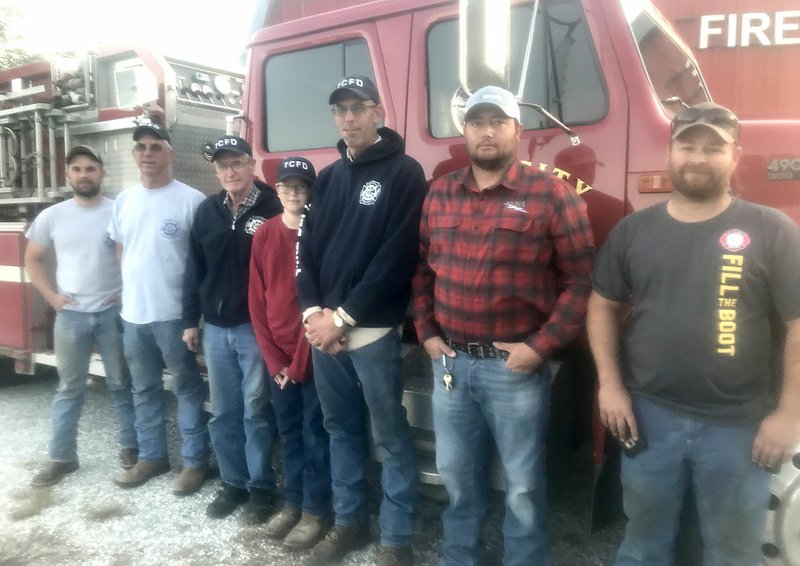 Sally Carroll/McDonald County Press Tiff City firefighters include Jacob Pierce (left), Dewey Pierce, assistant chief Richard Huston, junior firefighter Case Huston, Scott Huston, John Moore and Nate Walter. Not pictured are Chief Terry Renner, Christine House, Devin House, Cecil Matt Michael, Keisha Clark and Ted Huston.