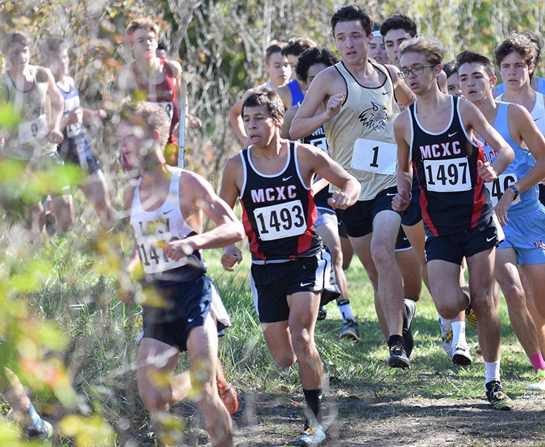 RICK PECK/SPECIAL TO MCDONALD COUNTY PRESS McDonald County' David Lazalde (1493) leads teammate Garrett Spears (1497) in the early stages of Saturday's Missouri Class 4, District 6, Cross Country Championships at Raymore-Peculiar High School. Spears ended up with a 29th place finish to qualify for sectionals, while Lazalde faded to 44th after battling an illness over the past two weeks.