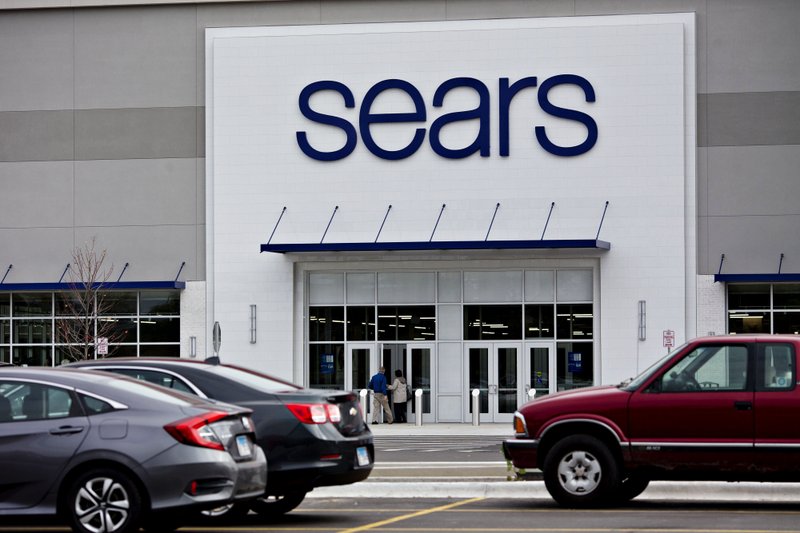 Shoppers enter a newly renovated Sears Holdings Corp. store in Oak Brook, Ill., on Oct. 14, 2018. 