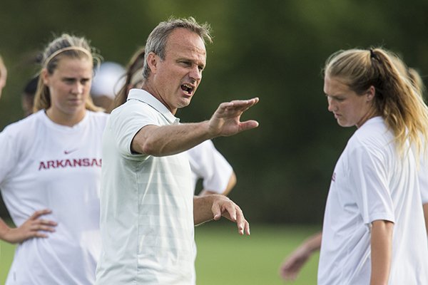 Arkansas coach Colby Hale talks to players during warmups prior to a game against Texas A&M on Thursday, Sept. 20, 2018, in Fayetteville. 