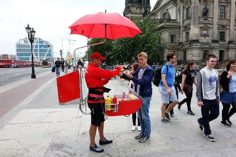 Sampling one of Germany’s hundreds of varieties of sausage from a street vendor is a classic German experience. 