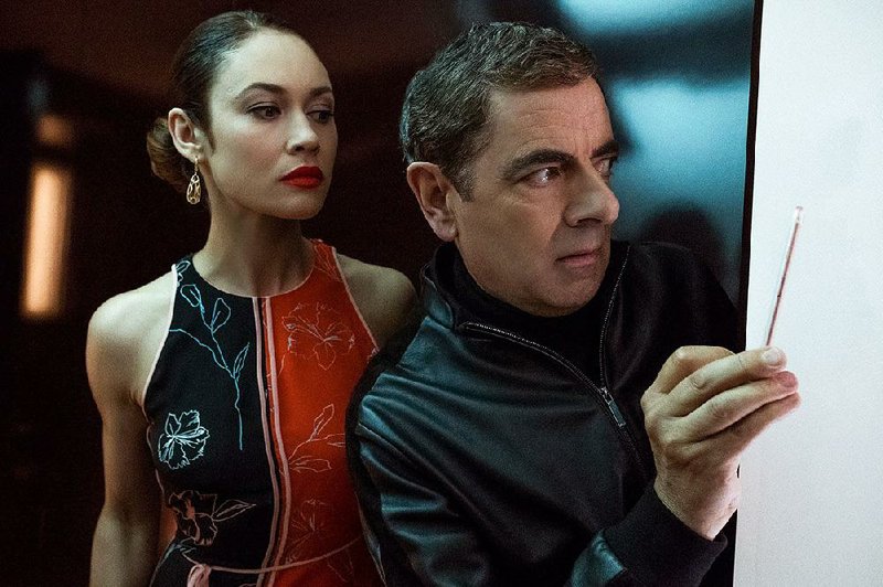 Johnny English (Rowan Atkinson) returns because, well, James Bond is unavailable and no one can figure out anything else to do in Da- vid Kerr’s spy spoof Johnny English Strikes Again. 