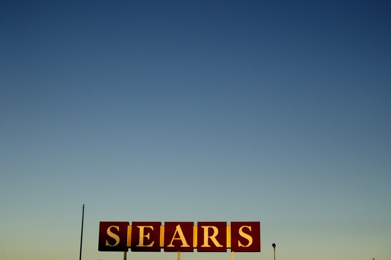 FILE- In this Oct. 16, 2018, file photo a sign for a Sears appliance outlet store is displayed in Kansas City, Mo. Since filing for Chapter 11 bankruptcy, Sears Holdings Corp. has been trying to convince suppliers to keep shipping it merchandise by touting the $300 million in financing it has secured so that its business can continue operating through the holidays. But a growing number of manufacturers who themselves got hurt or watched others get burned by Toys R Us&#x2019; quick demise are still nervous. (AP Photo/Charlie Riedel, File)