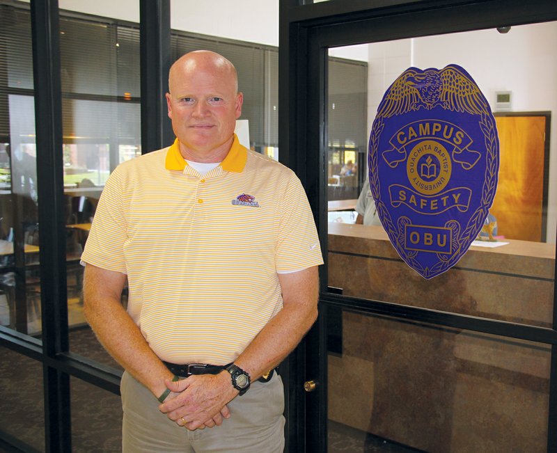 Jeff Crow, the director of Safety and Emergency Management at Ouachita Baptist University in Arkadelphia, stands in front of the campus police department in the middle of the Evans Student Center. 