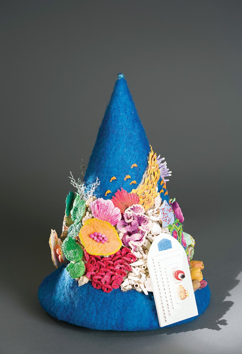 Barbara Cade created this hair hat sculpture, Hit and Run, in 2017, using wet wool felting, ceramics, wool, clay and paint.