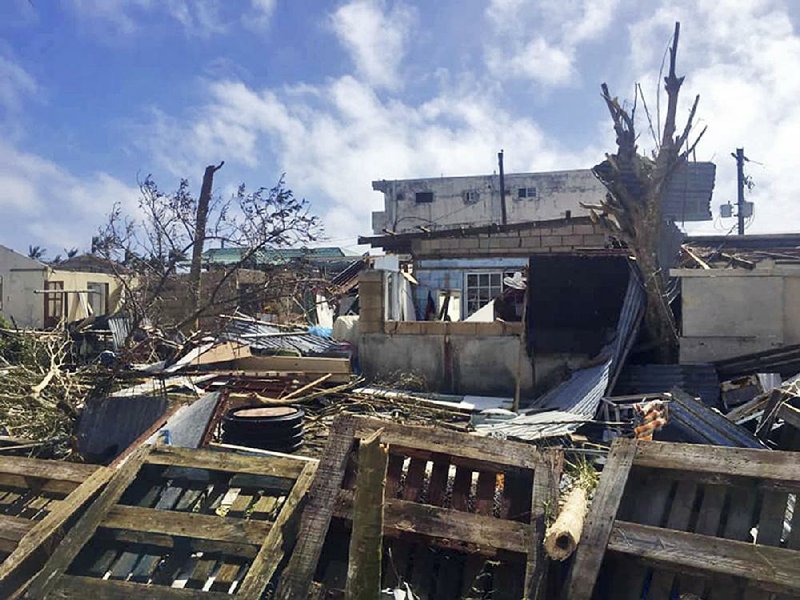 Buildings on the island of Saipan lie in ruin Friday in the aftermath of Super Typhoon Yutu, which hit the Northern Mariana Islands earlier in the week.