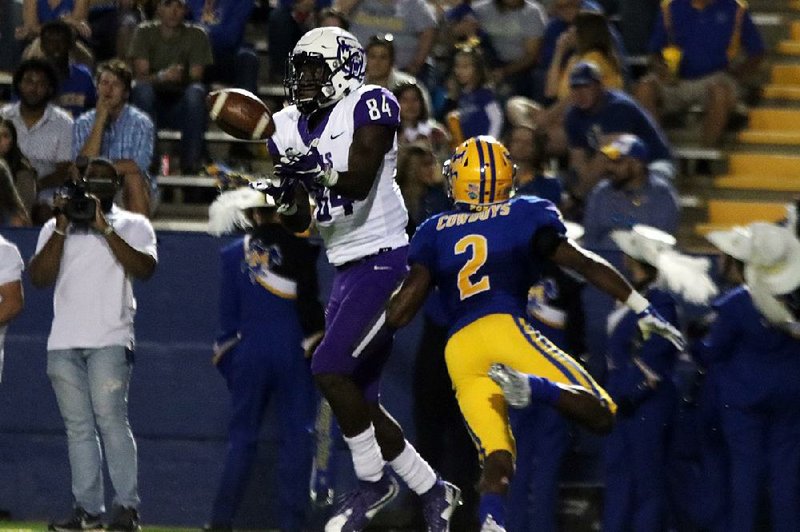 Central Arkansas wide receiver Brandon Myers catches a pass in front of McNeese State defensive back Cory McCoy on Saturday during the Bears 23-21 loss to the Cowboys in Lake Charles, La. 