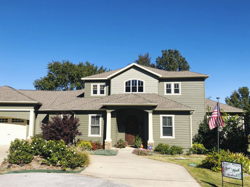 Courtesy photo Dave and Holly Meehan have been named this month's Beaver Shores POA Yard of the Month. The couple built their home in 2009 and live at 16724 Cypress Lane. Currently they have several blooming flowers including Encore Azaleas, Knockout Roses, Lantana, Vinca, Sedum Autumn Joy and Gomphrena. The Meehans were awarded a $25 gift card from sponsor Bradford Yard Living + Landscaping.