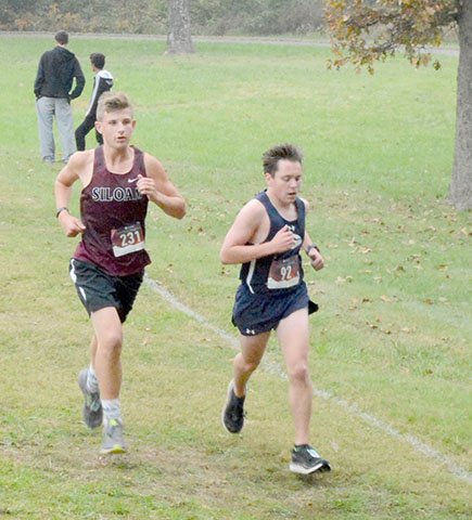 Hunter McFerrin/Siloam Sunday Siloam Springs runner Luke Fields runs during the 5A-West Conference Meet on Thursday at the Simmons Course.