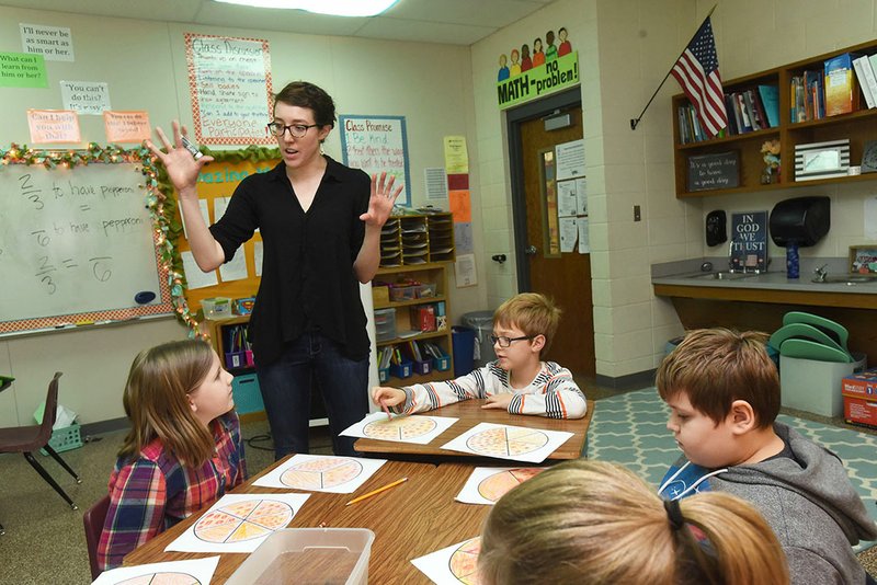 NWA Democrat-Gazette/FLIP PUTTHOFF Teacher Becca Braun teaches a lesson on fractions Tuesda to her third-grade class at Reagan Elementary School in Rogers. Braun traveled to New Zealand with Reagan Principal Laura Quillen and other Northwest Arkansas educators.