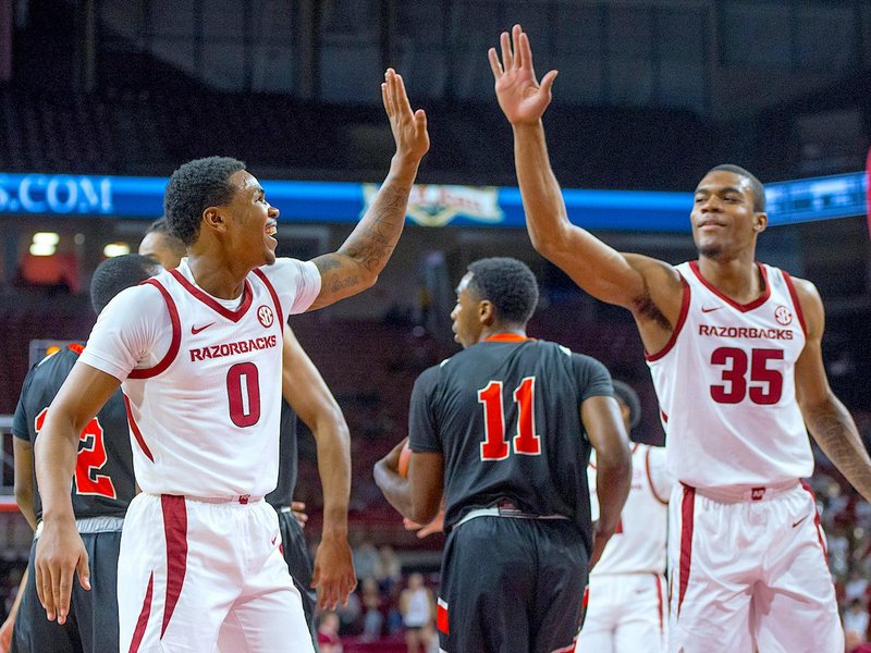NWA Democrat-Gazette/BEN GOFF @NWABENGOFF 
Desi Sills (0) and Reggie Chaney of Arkansas high five after a play in the first half vs Tusculum Friday, Oct. 26, 2018, during an exhibition game in Bud Walton Arena in Fayetteville. 