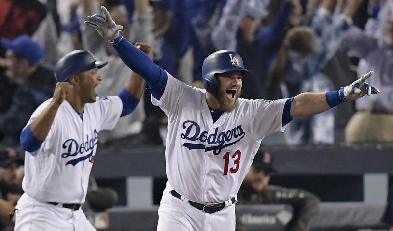 Los Angeles Dodgers' Max Muncy celebrates his walk off home run against the Boston Red Sox during the 18th inning in Game 3 of the World Series baseball game on Saturday, Oct. 27, 2018, in Los Angeles. (AP Photo/Mark J. Terrill)