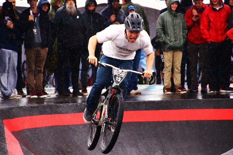 Even in the rain, Collin Hudson, of Colorado, becomes airborne Oct. 13 as he exits a sharp turn to attack the back straightaway of the Runway Bike Park during the Red Bull Pump Track World Championships. 