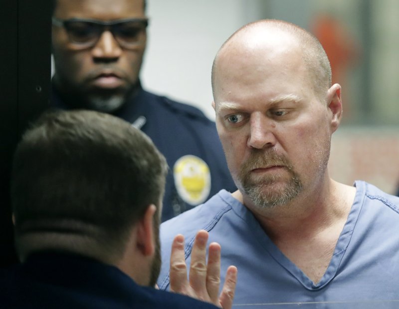 Gregory Bush, right, is arraigned on two counts of murder and 10 counts of wanton endangerment Thursday, Oct. 25, 2018, in Louisville, Ky. Bush fatally shot two African-American customers at a Kroger grocery store Wednesday and was swiftly arrested as he tried to flee, authorities said Thursday. (Scott Utterback /Courier Journal via AP, Pool)

