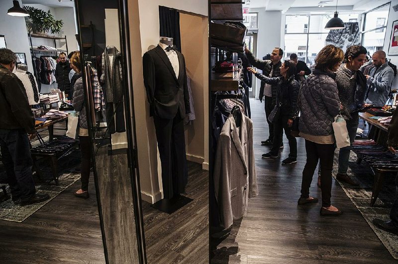 Shoppers browse at a Bonobos Inc. men’s clothing store earlier this month in Greenwich, Conn. Consumer spending rose 0.4 percent in September, while personal incomes rose 0.2 percent, the smallest gain since June 2017, the government reported. 