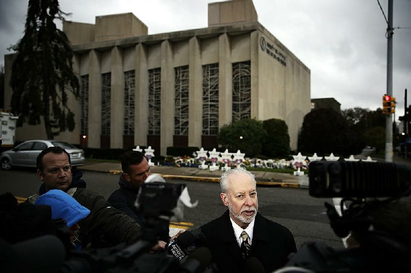 Rabbi Jeffrey Myers of the Tree of Life Congregation stands across the street from the synagogue in Pittsburgh on Monday.