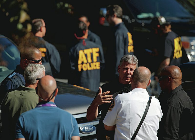 The Associated Press AGENTS GATHER: Law enforcement officials gather outside a U.S. post office facility after reports that a suspicious package was found in Atlanta, Monday. The FBI said authorities recovered the suspicious package that was address to the cable network CNN.