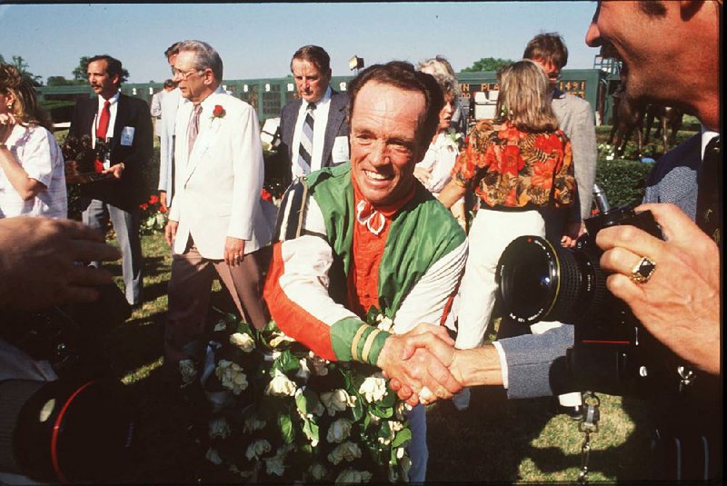 Jockey Larry Snyder is congratulated after winning the 1989 Arkansas Derby aboard Dansil at Oaklawn Park in Hot Springs. Snyder died Monday. He was 76. 