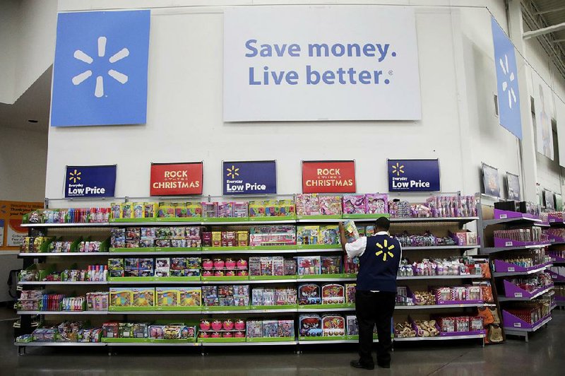 Walmart employee Kenneth White scans items during a Walmart Academy class session at the store in North Bergen, N.J. Starting Thursday, Walmart employees will be able to use mobile devices to process some shoppers’ payments, allowing them to bypass long checkout lines.

