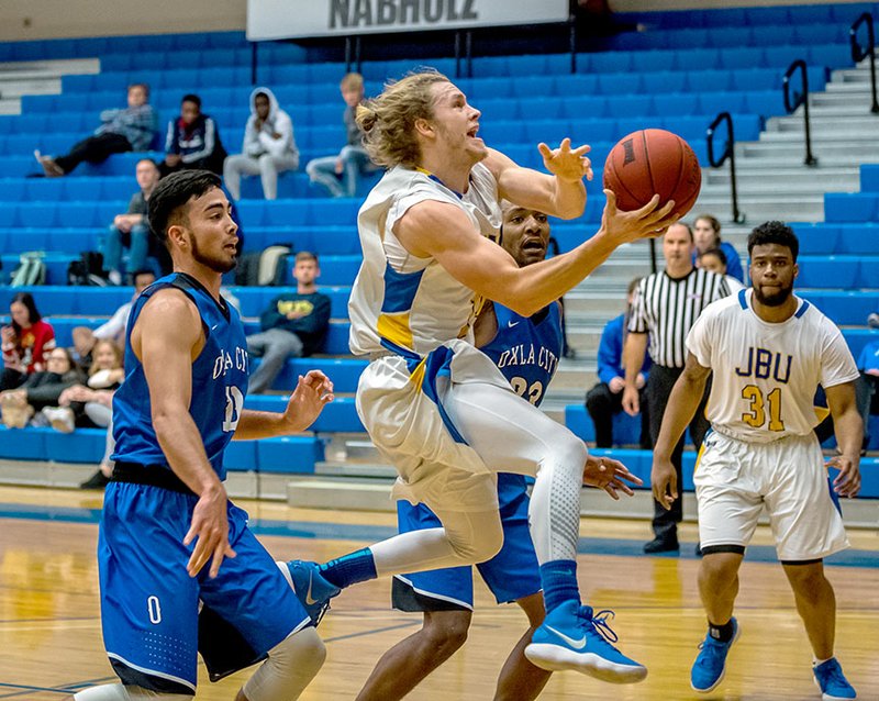 Photo courtesy of JBU Sports Information John Brown guard Jake Caudle of Bentonville returns to the Golden Eagles basketball team this fall after leading JBU in scoring last season and earning All-Sooner Athletic Conference first team honors.