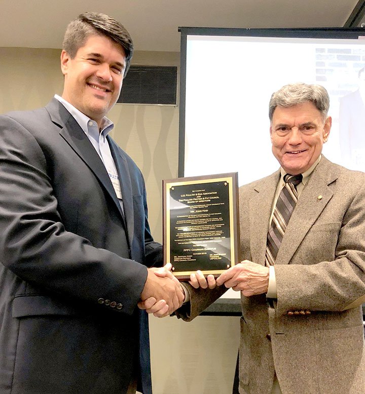 Photo submitted John Haid of Siloam Springs, right, was presented with an award naming him chairman emeritus of the Poultry Protein &amp; Fat Council Board of Directors by current chairman Johnathan Green on Oct. 4.