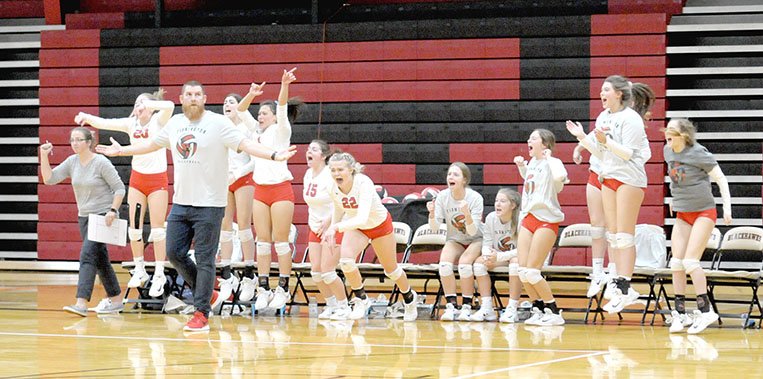 MARK HUMPHREY ENTERPRISE-LEADER Farmington volleyball coaches Mike Howard and Diandre Bennett react as bench players rejoice over a set victory over Berryville during the District 4A-1 volleyball tournament held at Pea Ridge on Tuesday, Oct. 16, 2018. The emotionally-draining 5-set match took its toll and Farmington went down in straight sets to Shiloh Christian in the semifinals played the same day.