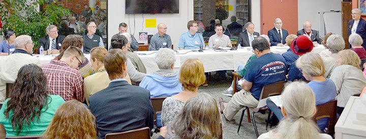 Keith Bryant/The Weekly Vista City council Ward 3, Position 2, candidate J.B. Portillo, left, sits with Ward 3, Position 2, candidates Jack Kelly and Steve Bourke; Ward 2, Position 2, candidates Larry Wilms, Brent Stinespring and Christian Henning; Ward 1, Position 2, candidates Dylan Shaddox and John Flynn; and mayoral candidates Chris Narloch and Peter Christie, while library foundation chair Susan Santos welcomes the audience.